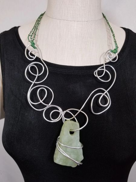 Aluminum Swirls, Green Leather and Light Green Rough Cut Stone Necklace