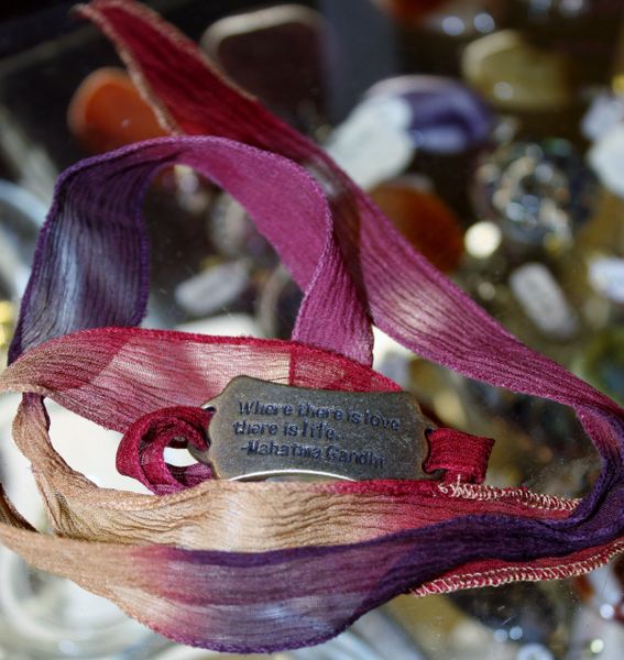 Hues of Ruby Red, Magenta, Purple and Cream Silk "Tie and Tuck" Wrap Bracelet Embellished with Bronze Quote