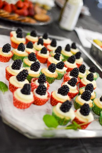 Mini cupcakes tray topped with blackberries