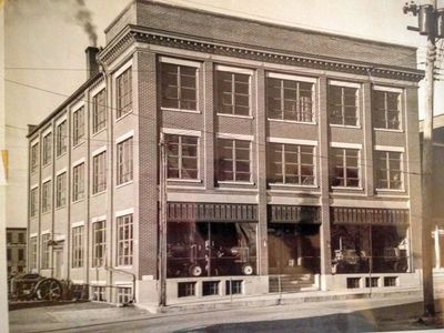 A.B.C. Groff Inc in the mid 1940 s with tractors in windows, John Deere and Caterpillar 