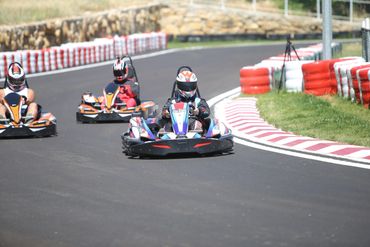 Friends racing during the day with 9hp and 15hp karts.