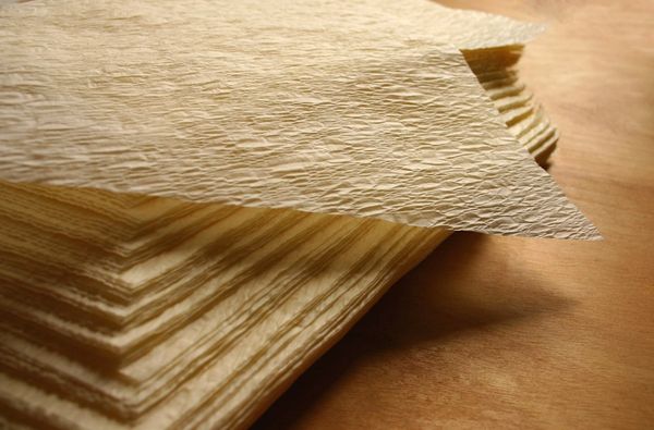 an 8 x 9 inch textured tamale parchment wrap (corn husk substitute); large: square 8 x 9 inch, corn-yellow, case of 1,000