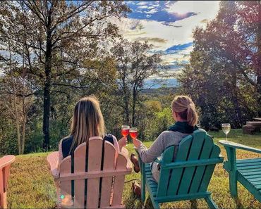 two women enjoying the view from out back at Byrd Cellars overlooking the valley