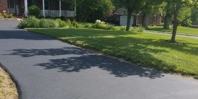 Driveway with new sealcoat.