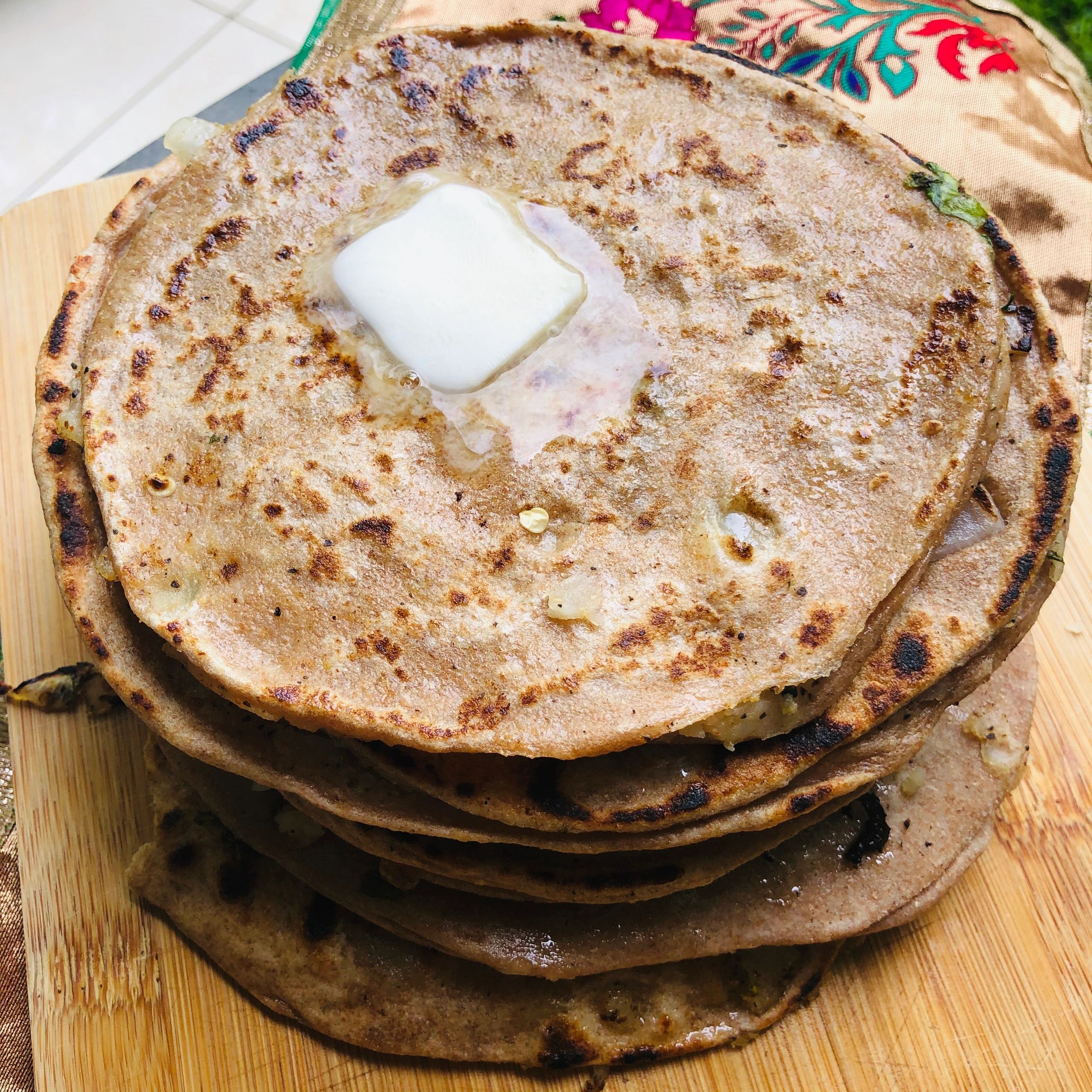 Aloo ka Paratha. Potato stuffed flatbreads with a pat of butter on top.