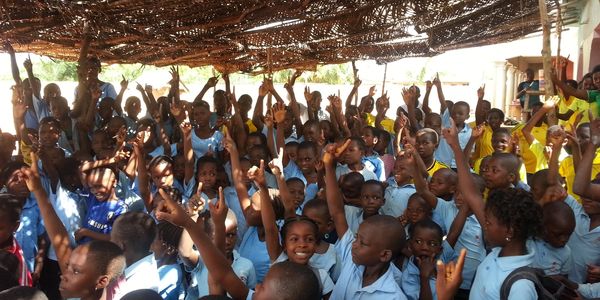 a large group of children in Togo Africa on a short-term mission trip with teachers 