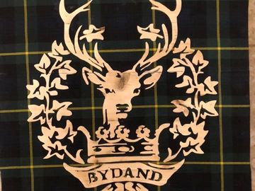 gordon highlanders cap badge. rustic artwork. wood picture.