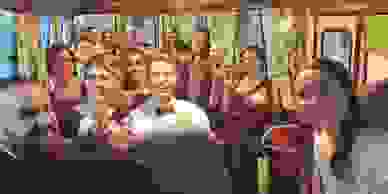 Wedding guests being transported onboard The Avocado Bus in Perth