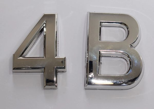 DOB SIGNS: 1 SIGN– SILVER (PLASTIC NUMBERS FOR MAIL BOXES IN NYC)