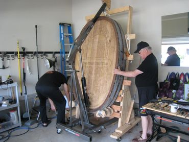 Positioning the cask end on the carving rack.