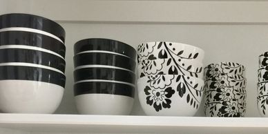 Black and white bowls showcased in a kitchen organized by Pretty Neat Professional Organizing.