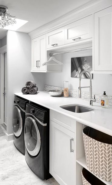 transitional white shaker laundry room custom cabinets to ceiling hamper basket open shelf sink