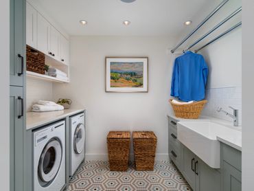 custom laundry room cabinets blue green painted cabinetry