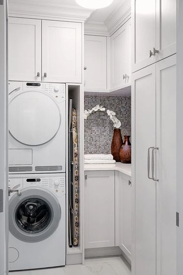 small custom laundry room cabinets white painted shaker door iron board storage stacked washer