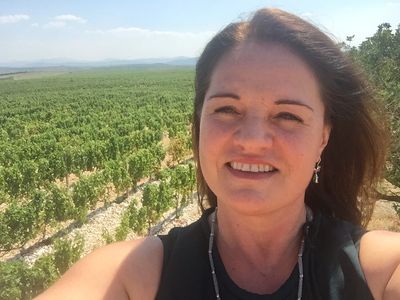 Founder, Indira Bayer, taking a selfie in the vineyards where Wines of Illyria grows. 