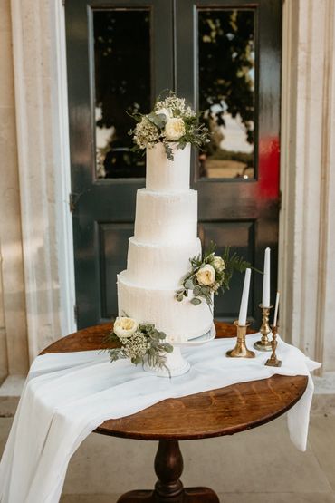 4 tier white wedding cake, wedding cake with flowers, classic white wedding cake,  buttercream white