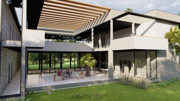 Modern two-story house with open living area and natural elements.