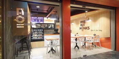 Modern dessert cafe with clean design and seating.