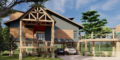 Modern stilt house with wooden accents and a connecting bridge under a blue sky.