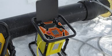 Aluminium fascia on a pipe welding unit outside in the snow.