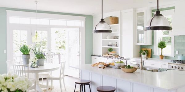 Custom Home Kitchen with recess cans and Kitchen Pendants