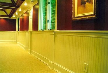 Basement Remodel with tray ceilings, recessed lighting, wainscotting, and beadboard paneling