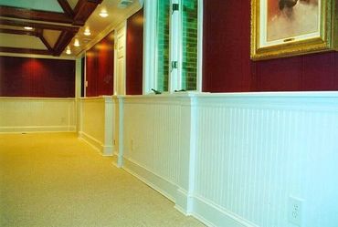 Basement Remodel with tray ceilings, recessed lighting, wainscotting, and beadboard paneling