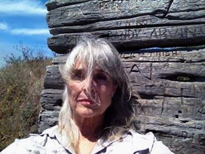 Author on legendary wooden bench, Portugeuse Beach, Mendocino, CA