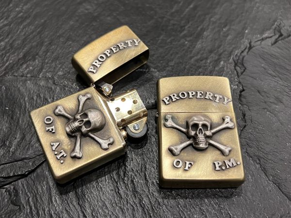 1 CUSTOM BRASS AND STERLING SILVER PROPERTY OF ZIPPO