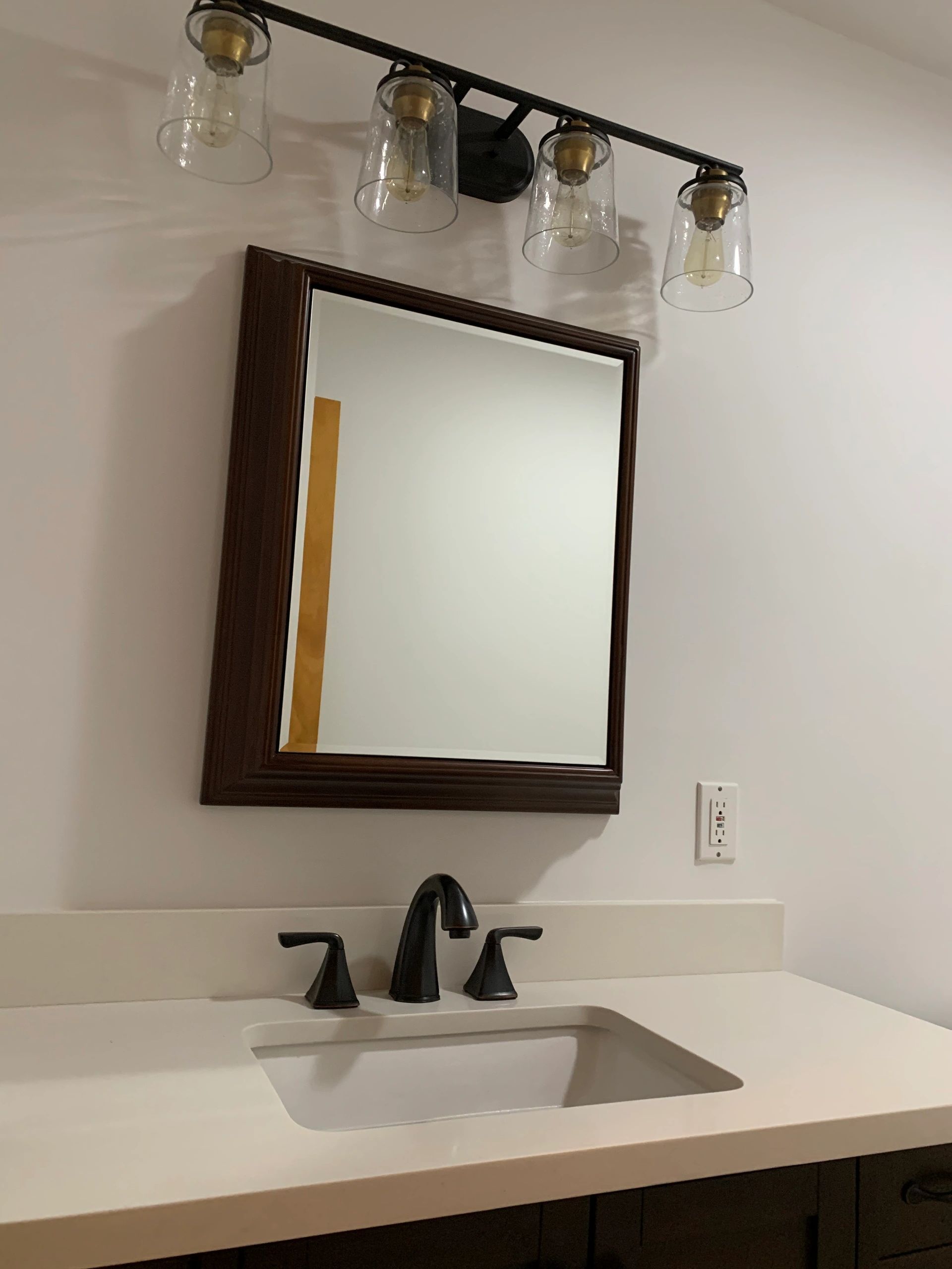 light fixtures, medicine cabinet, faucet, countertop installation