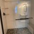 Shower tile installation. Sliding glass door installation. Custom-made shower bench.