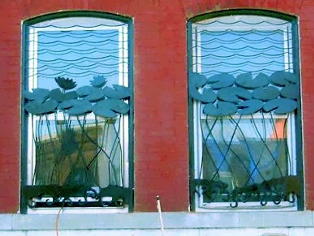 lilypads, window bars, ornate security, artistic patina, wrought iron