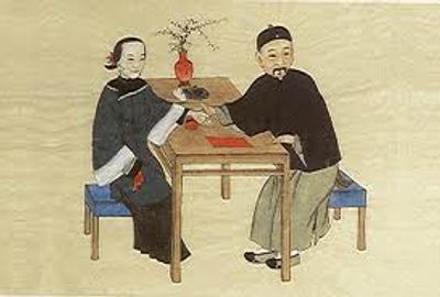 Traditional Chinese Medicine doctor taking the hans of its patient 