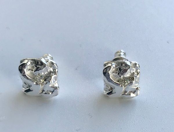 Frozen Studs with small Diamonds.