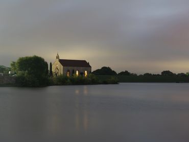 Fine art photography of a lakeside chapel