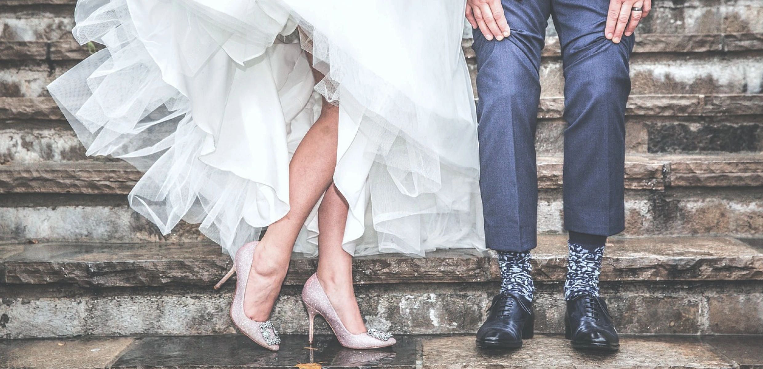 Bride and groom dancing on steps at their wedding.  