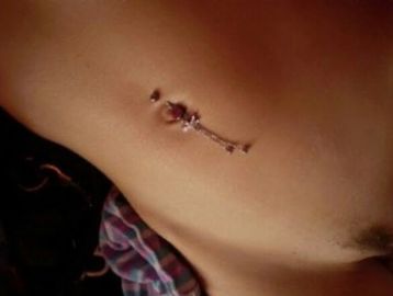 Polly Amorous sexy mature escort's flat stomach with belly piercing