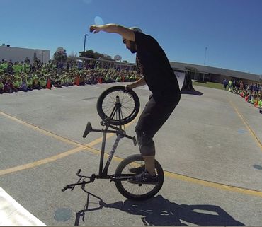 Scott Weaver doing a Hitchhiker at a local BMX school show assembly.