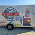 Side view of the Mr. Scrub mobile trailer showing off the logo and phone number. 