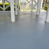 An after photo of a freshly power washed and sealed patio area. 