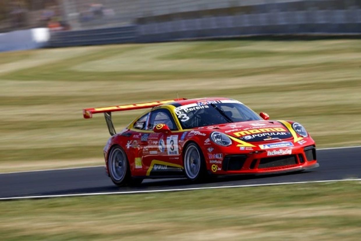 Red and yellow race car on a track.