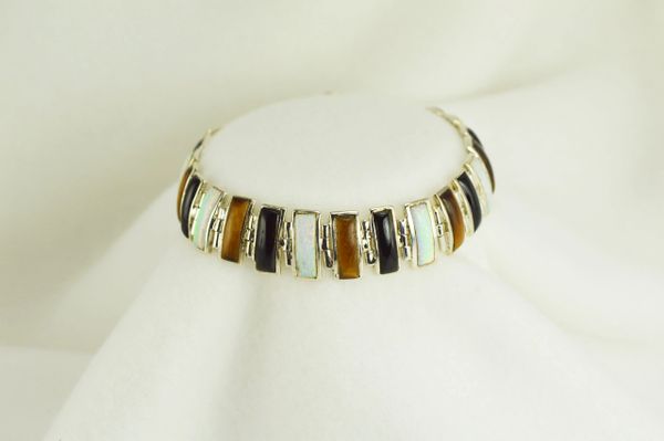Sterling silver multi color opal, black onyx and tiger eye 7.5" bracelet. B031