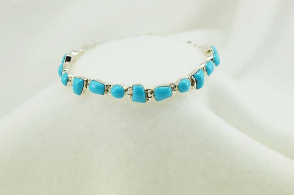 Sterling silver turquoise multi shape link 7.25" bracelet. B044