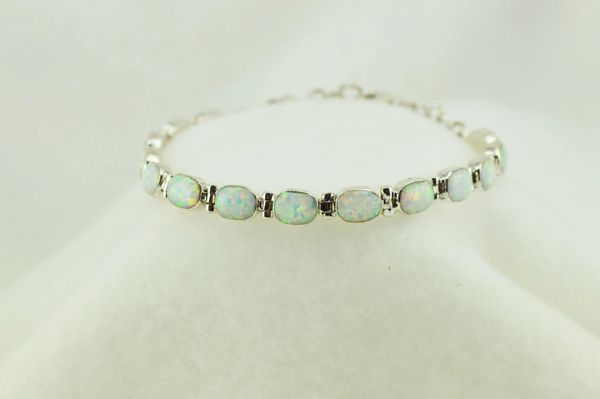 Sterling silver white opal oval link 7.25" bracelet. B088