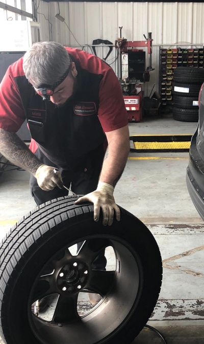 Matt Suits plugging a tire Anything Automotive & Transmission Braselton GA