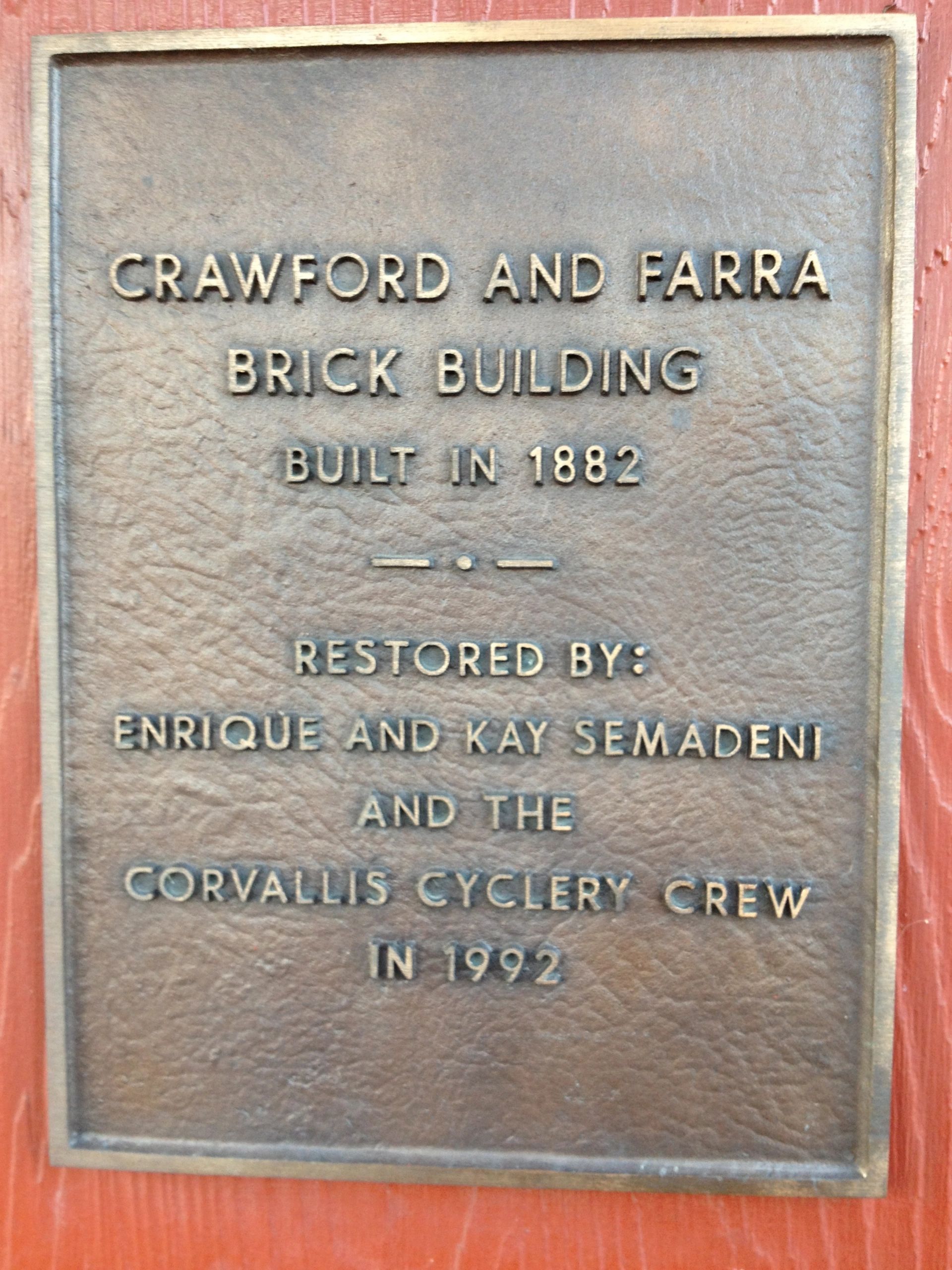 Crawford and Farra plaque on the SE Corner of the building. 
