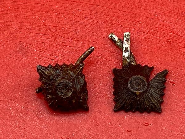 Pair of relic shoulder board silver rank pips which still retain a bit of original colour,uniform remains worn by soldier of the 1st Panzer Army recovered near the River Don area outside the City of Rostov on Don attacked by them in 1941 near Stalingrad