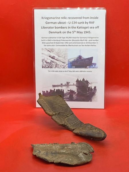 German crewman's leather axe cover remains and a rubber boot insole number 246 recovered from inside U-Boat U534 which was sunk on the 5th May 1945 by RAF Bombers