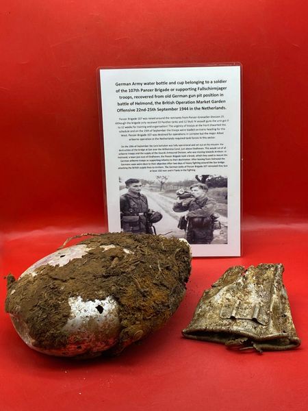 German waterbottle with remains of its cloth cover and drinking cup used by soldier of 107th Panzer Brigade recovered from old German gun pit position from the battle of Helmond, Operation Market Garden, September 1944, Netherlands.