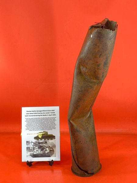 Battle damaged Russian 85mm brass shell case is dated 1944 well cleaned fired by T34 tank recovered South of Berlin in the area the German 9th Army fought, surrendered in April 1945 during the battle of Berlin